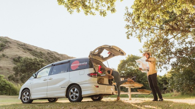 Campers planning trip at campsite