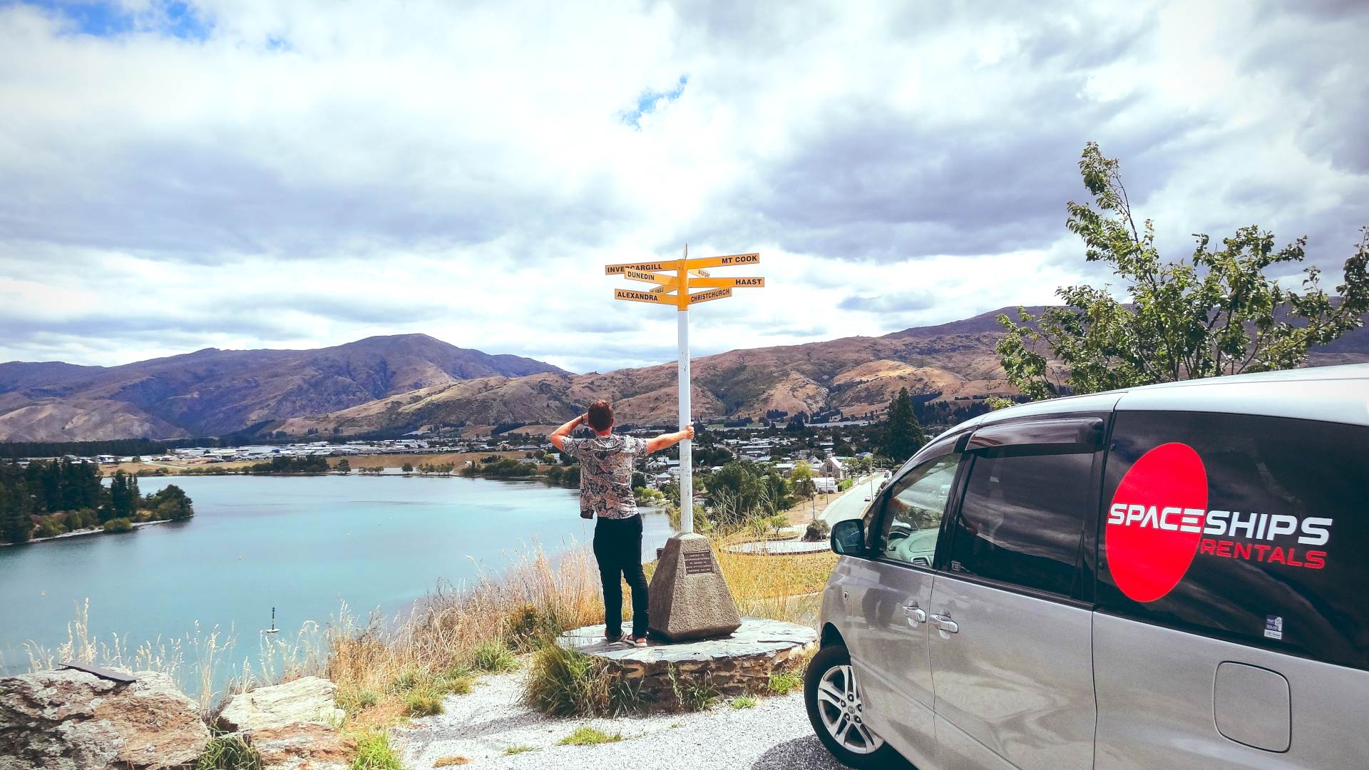 Campervan on the right, Space Traveller standing near signs with various places in New Zealand - Amazing scenery in background: mountains &amp;amp;amp;amp;amp;amp;amp;amp;amp;amp;amp;amp;amp;amp;amp;amp;amp;amp;amp;amp;amp;amp;amp;amp;amp;amp;amp;amp;amp;amp;amp;amp;amp;amp;amp;amp;amp;amp;amp;amp;amp;amp;amp;amp;amp;amp;amp;amp;amp;amp;amp;amp;amp;amp;amp;amp;amp;amp;amp;amp;amp;amp;amp;amp;amp;amp;amp;amp;amp;amp;amp;amp;amp;amp; see