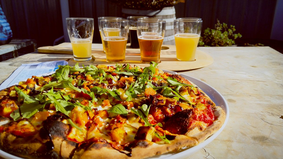 Image showing a tasty vegetarian pizza plus a tasting flight of craft beer @ Brew Moon, near Christchurch