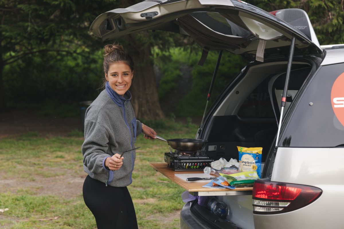 Space Traveller using the cooking gear that is included to create a tasty meal