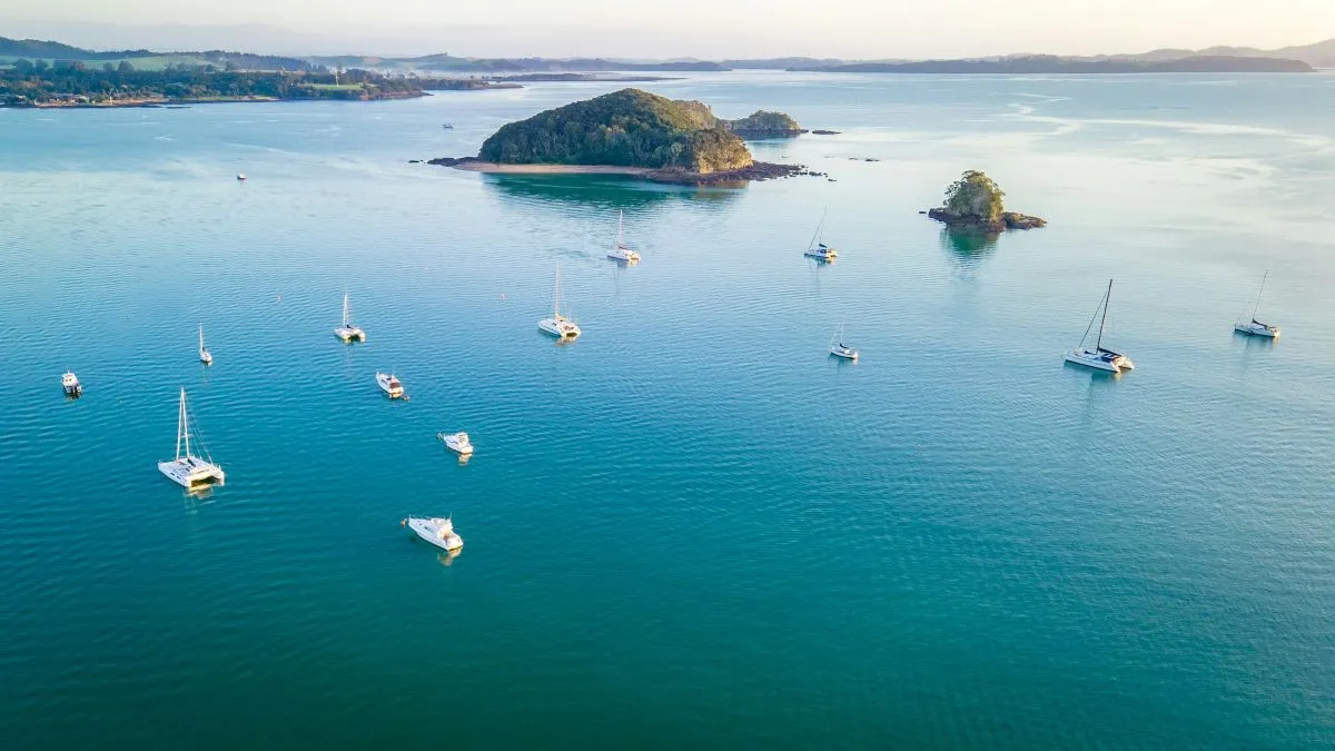 Birds eye view of the ocean with yachts parked and small islands scattered in the ocean